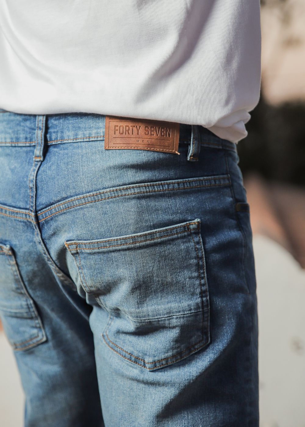 Men’s slim fit light blue jeans with tapered leg design