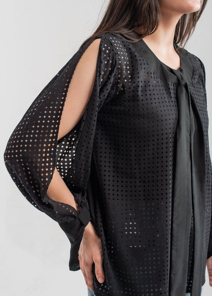 Women's formal top in black with laser cut details