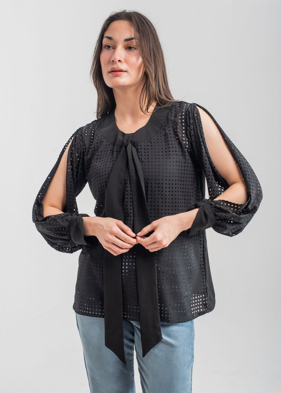 Women's formal top in black with laser cut details