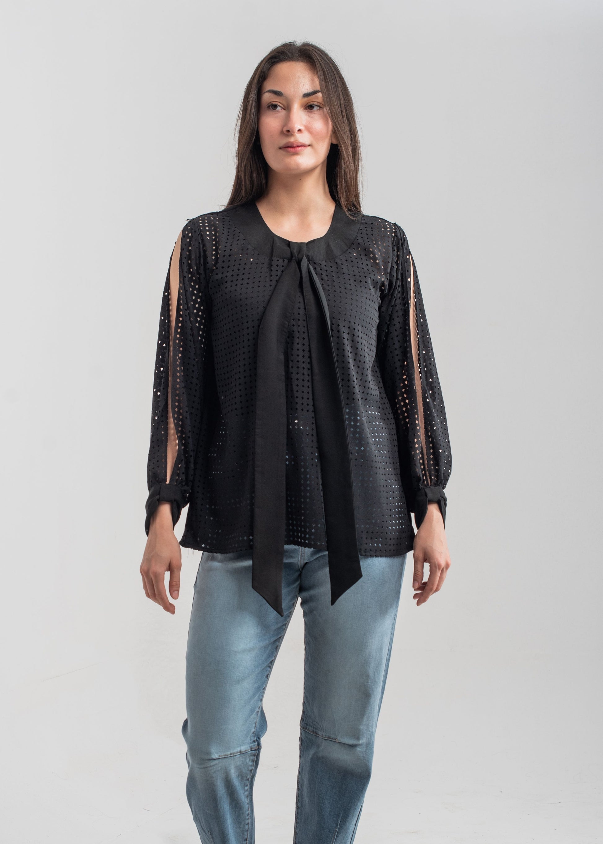 Women's formal top in black with laser cut details