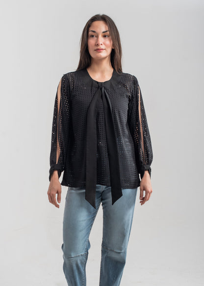 Women's formal top in black with laser cut details