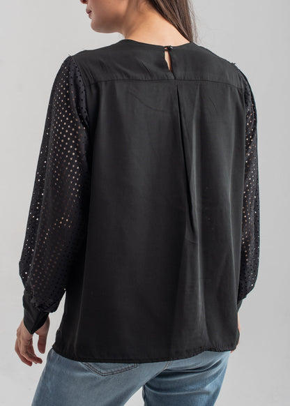 Women's formal top in black with laser cut details