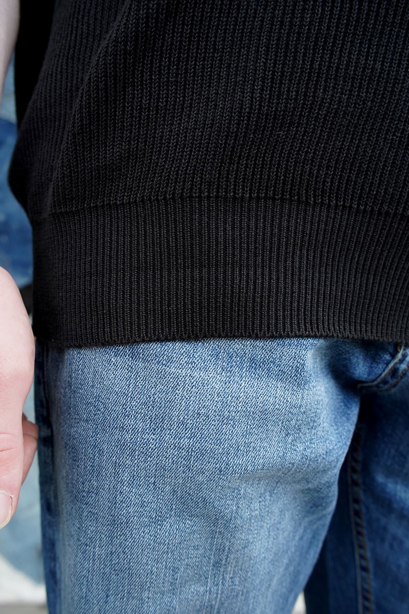 A Close-up of Men's Black Knitted Polo Shirt