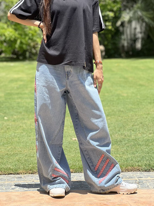 Girl wearing a light blue relaxed pant with blush accents by 1947 Clothing