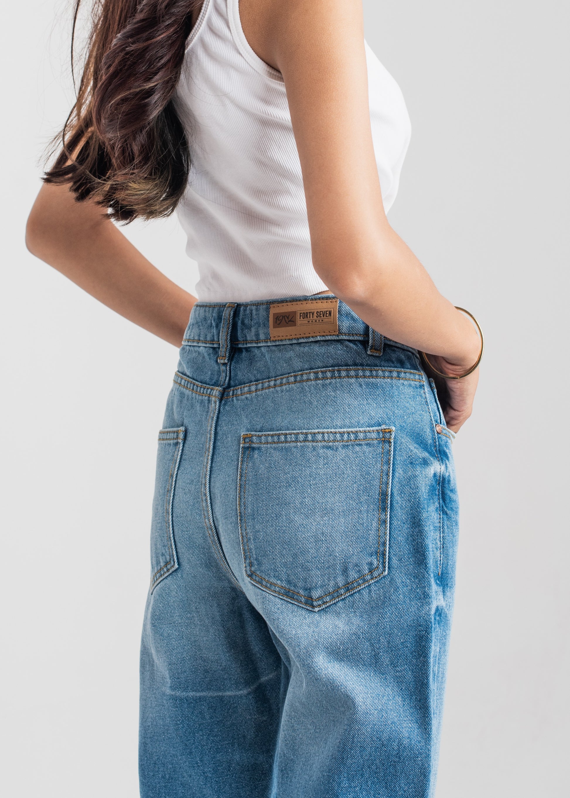 Women's Mom Jeans in Blue with a Straight Style and a High, Rounded Waist.