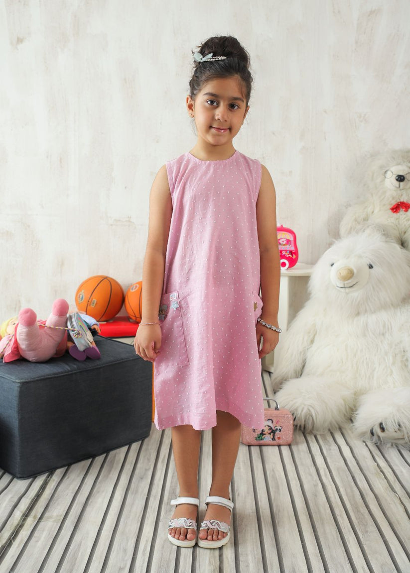 Girl's dress in pink with flower details and handy side pockets