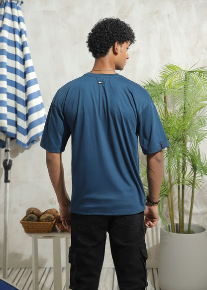 Men's oversized blue graphic t-shirt with drop shoulder fit