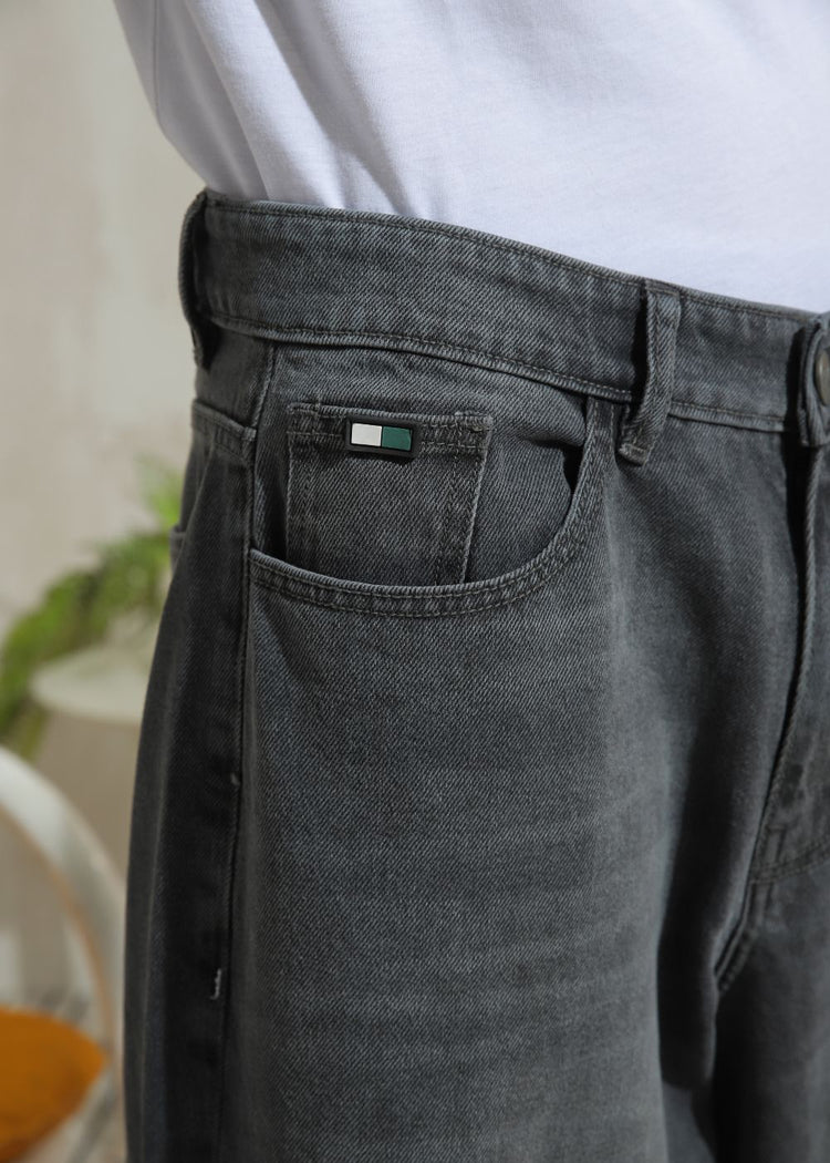 Men’s relaxed fit charcoal grey wide leg jeans with minimal detailing