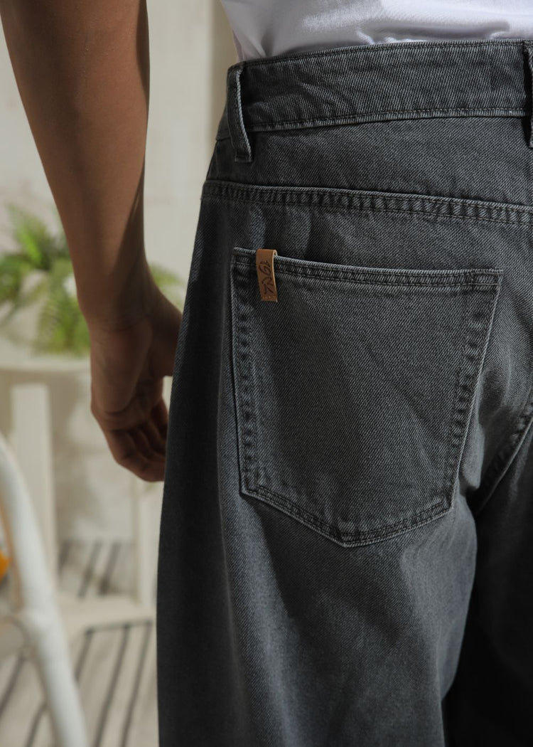 Men’s relaxed fit charcoal grey wide leg jeans with minimal detailing