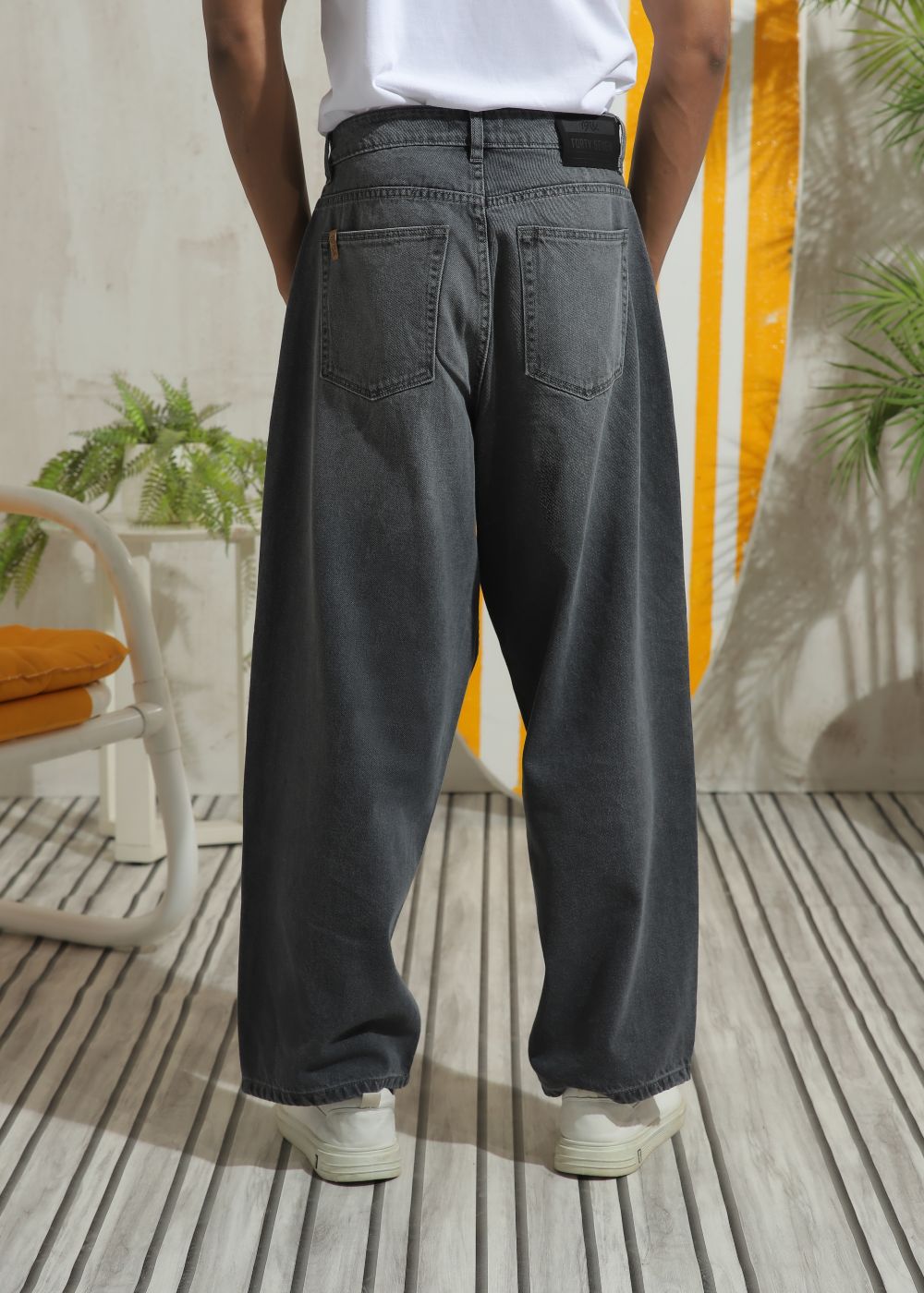 Men’s relaxed fit charcoal grey wide leg jeans with minimal detailing