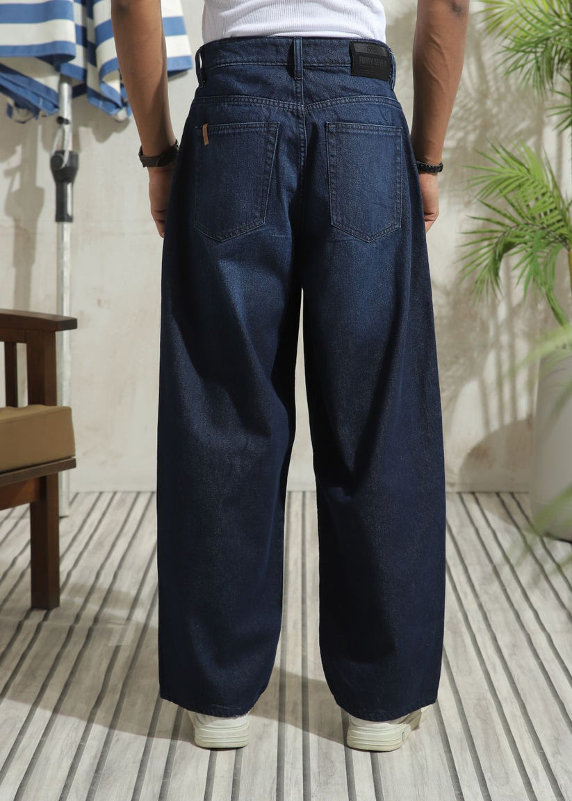 Wide-leg men’s denim jeans in dark blue with relaxed fit and clean minimal style