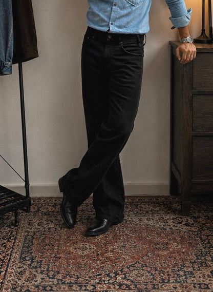 Person Wearing Jet Black Bootcut Jeans by 1947 Clothing