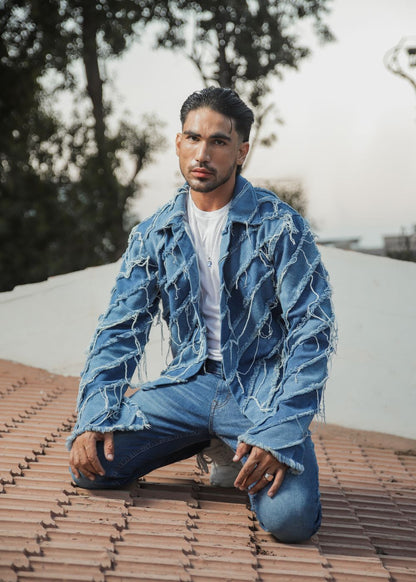 Men's light blue distressed denim jacket with frayed detailing