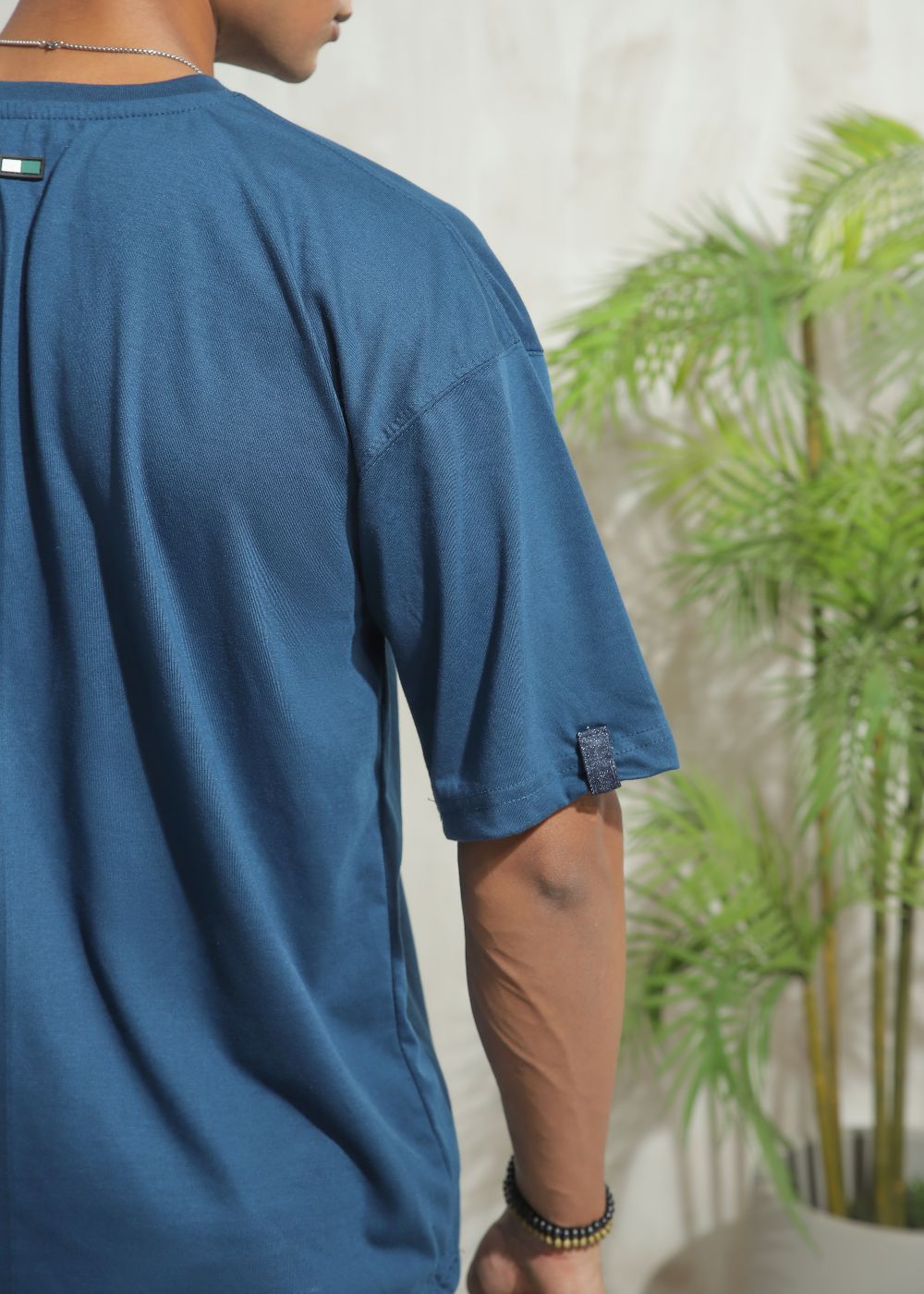 Men's oversized blue graphic t-shirt with drop shoulder fit