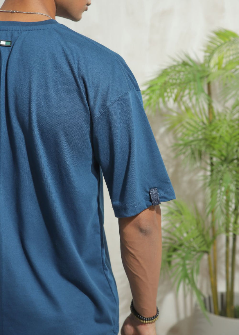 Men's oversized blue graphic t-shirt with drop shoulder fit