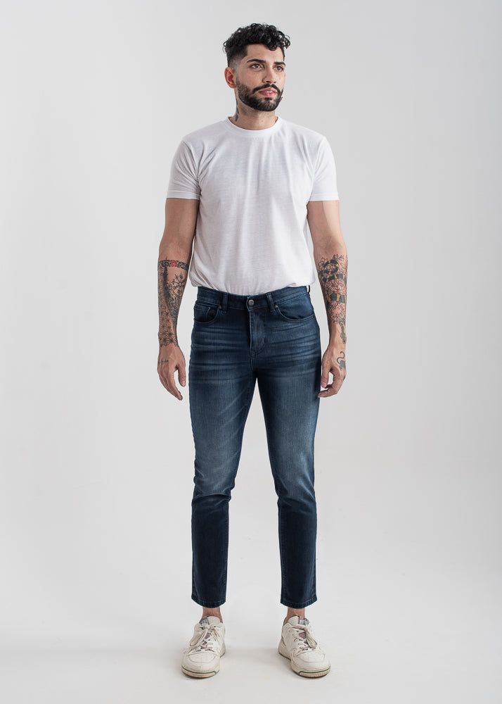 Men's slim fit dark blue jeans with whiskered wash detailing