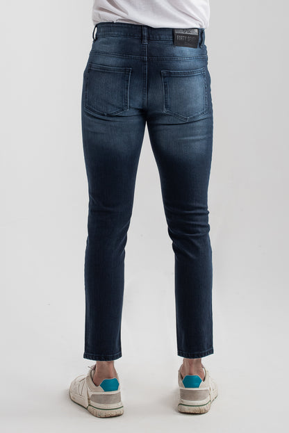 Men's slim fit dark blue jeans with whiskered wash detailing