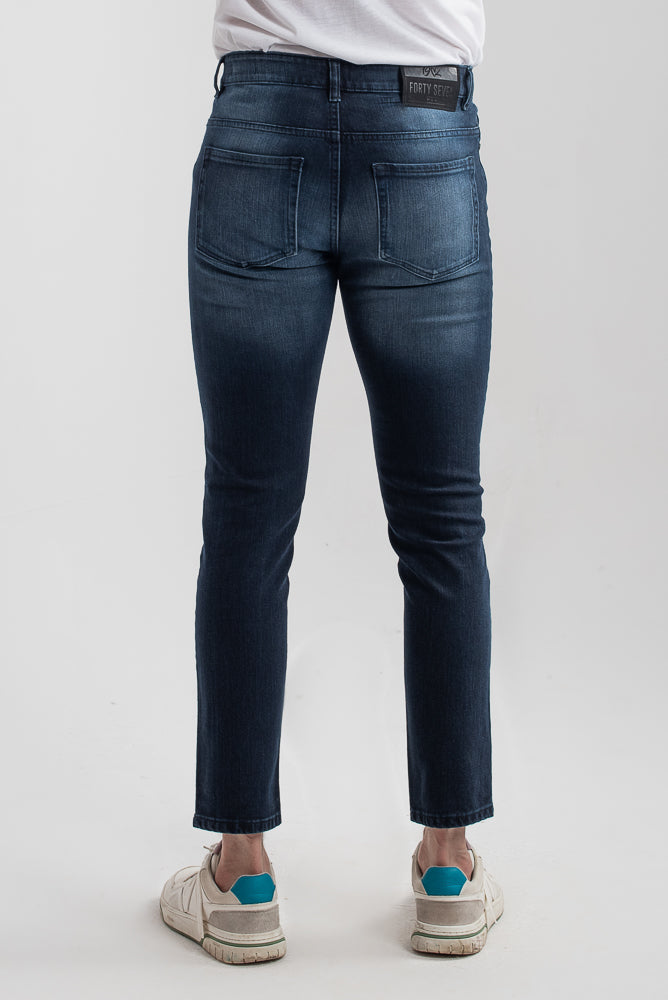 Men's slim fit dark blue jeans with whiskered wash detailing