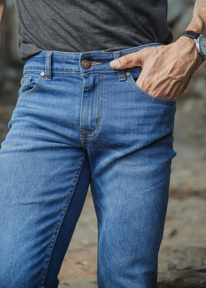 Men’s slim fit mid blue jeans with faded wash detailing