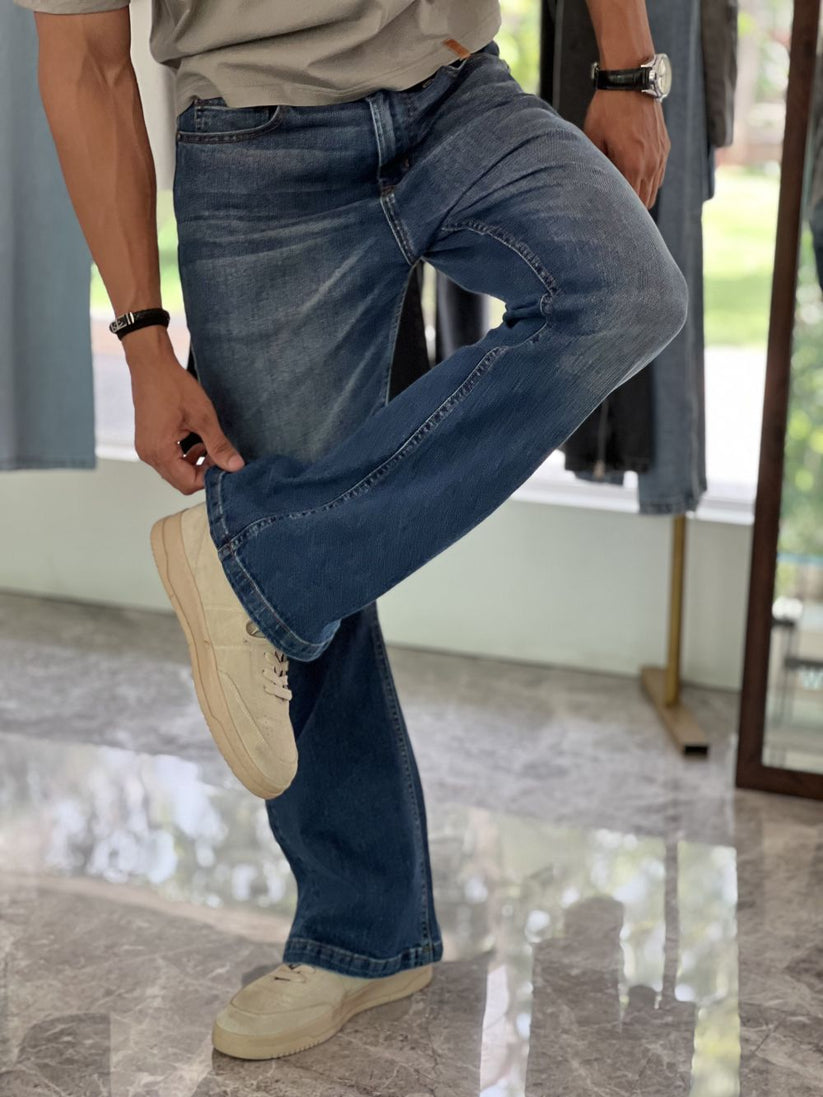 Person Wearing Mid Blue Bootcut Jeans by 1947 Clothing