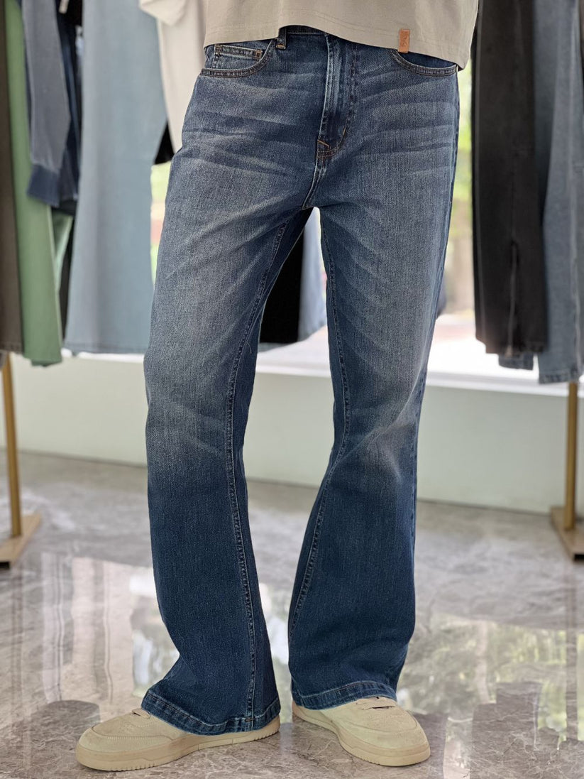 Person Wearing Mid Blue Bootcut Jeans by 1947 Clothing