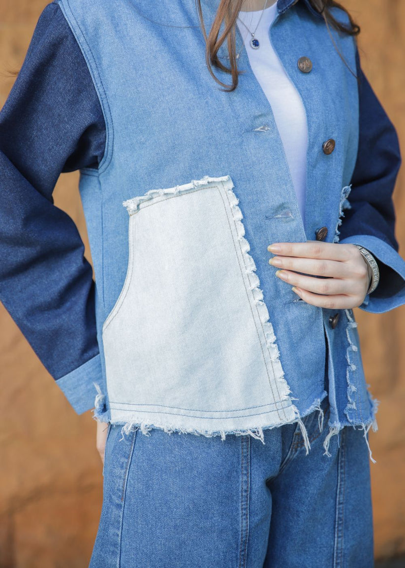 Women's blue denim jacket with patches