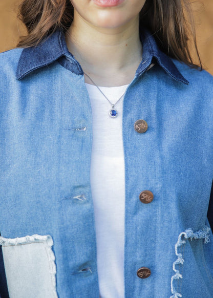 Women's blue denim jacket with patches