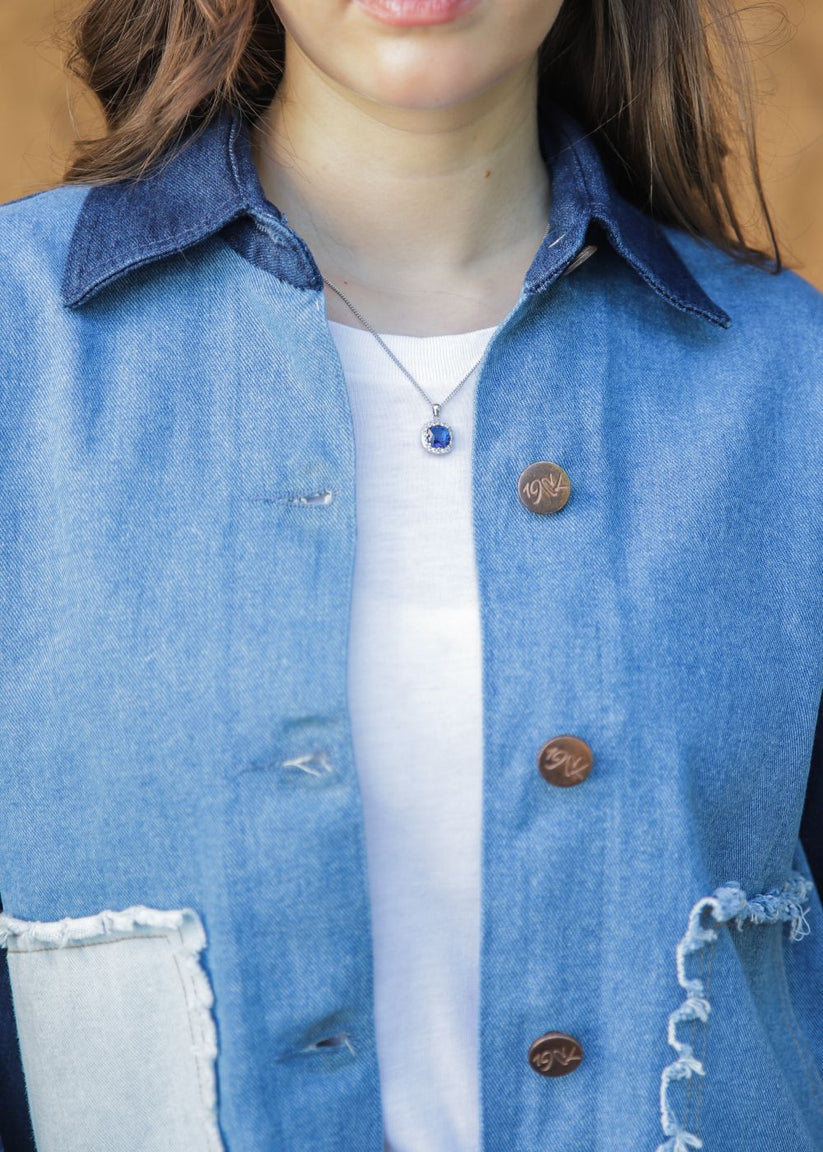 Women's blue denim jacket with patches
