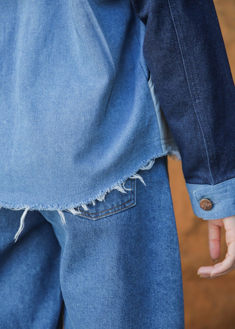 Women's blue denim jacket with patches