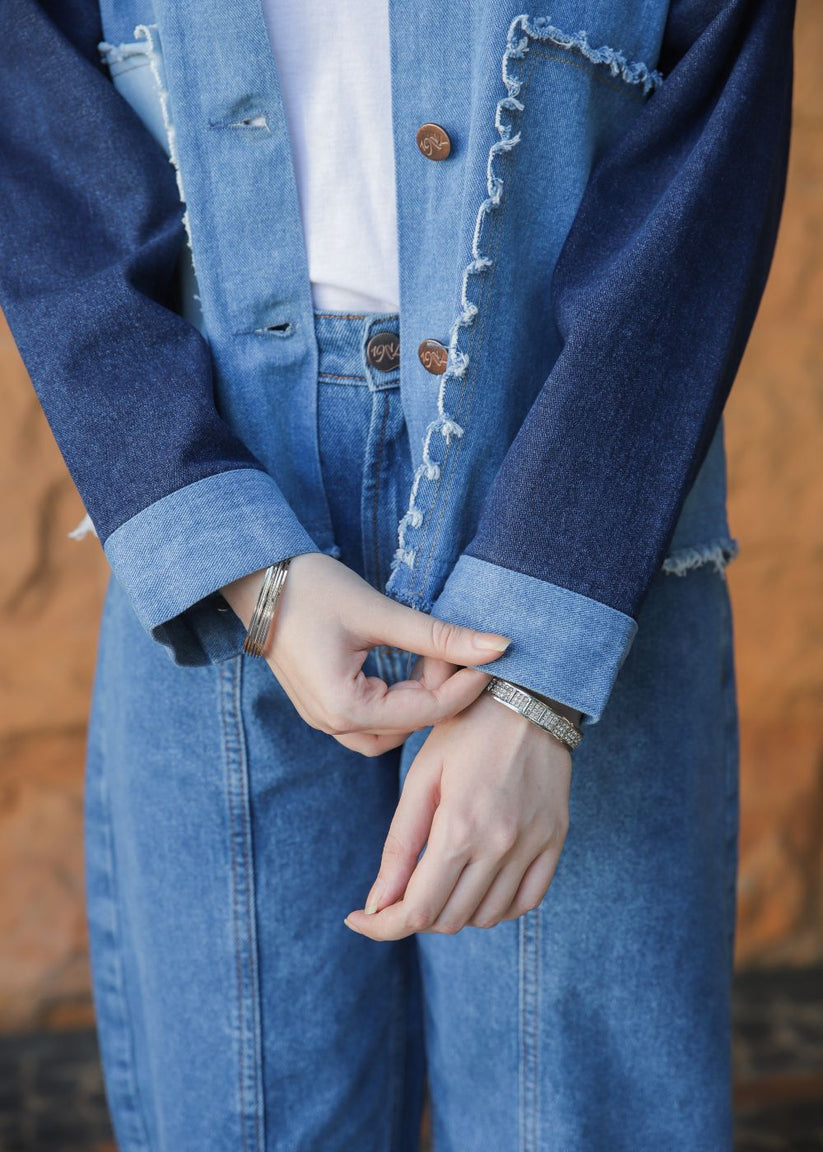 Women's blue denim jacket with patches