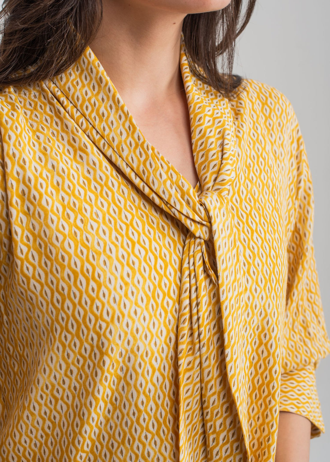 Women's Printed Top in Yellow with a Bow Neck 
