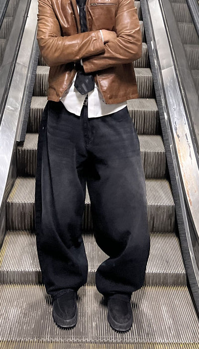Men’s oversized fit black wide leg jeans with flowy silhouette
