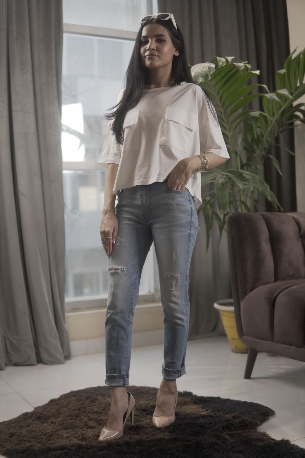 Women's Skinny Ripped Jeans in Light Blue Wash Featuring a Zipper Fly and Handmade Ripped and Repaired Abrasions