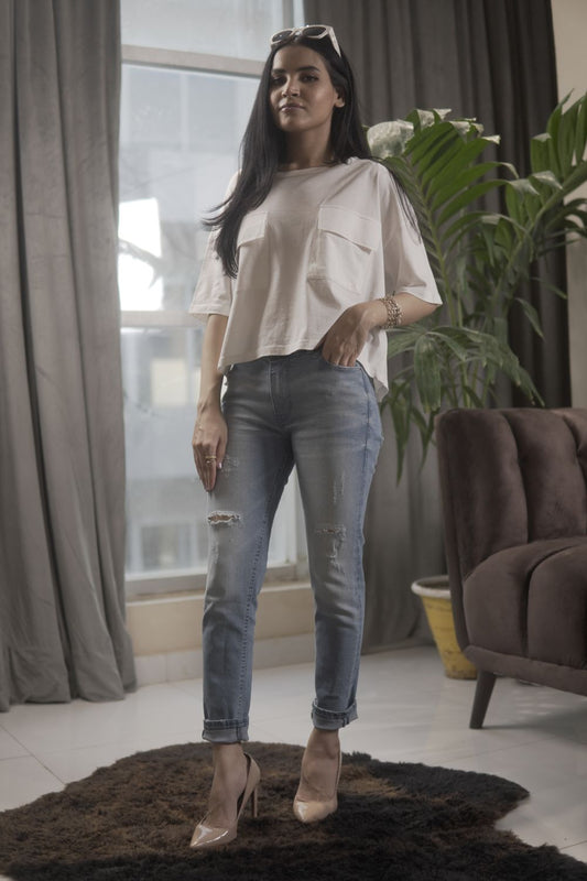 Women's Skinny Ripped Jeans in Light Blue Wash Featuring a Zipper Fly and Handmade Ripped and Repaired Abrasions