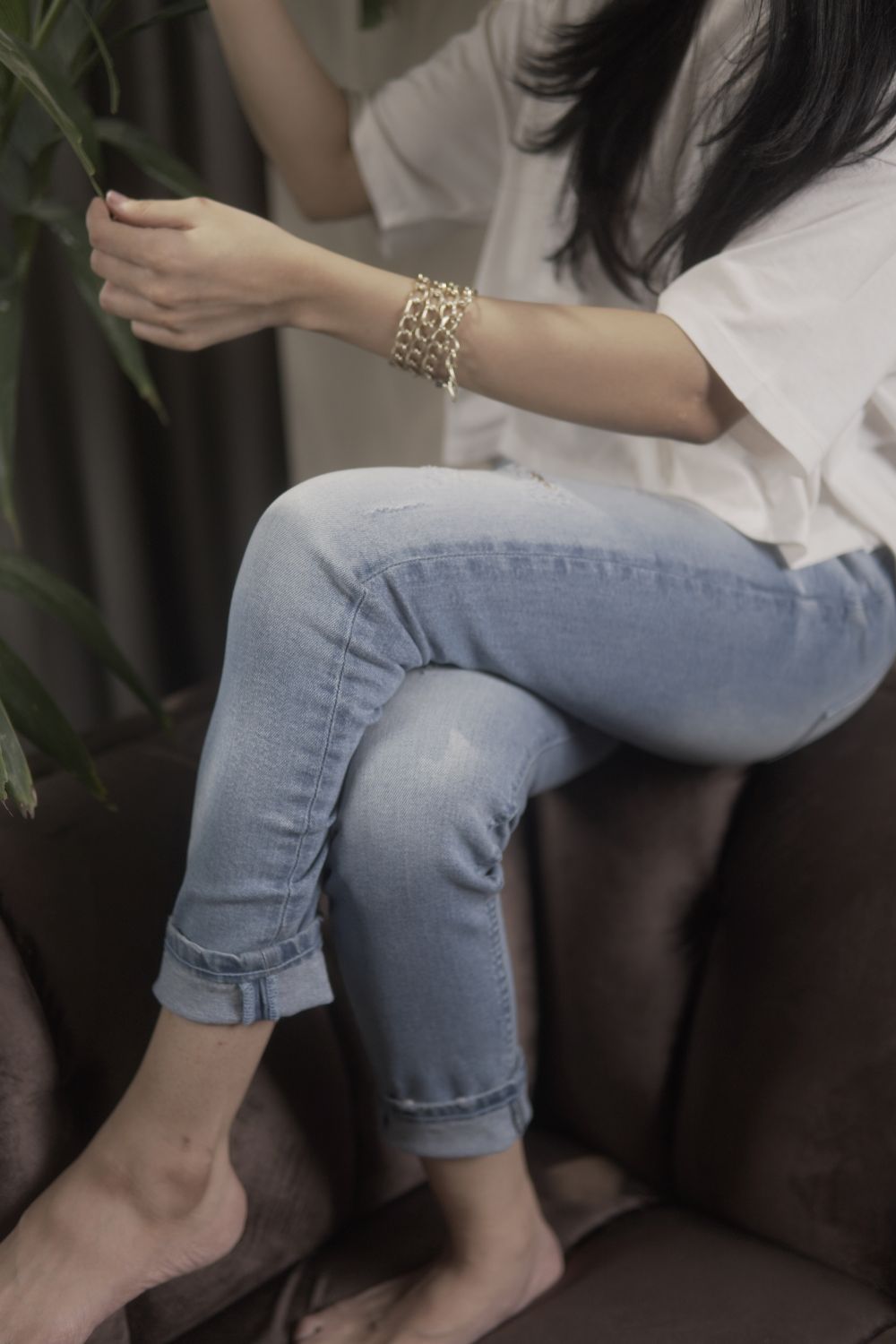 Women's Skinny Ripped Jeans in Light Blue Wash Featuring a Zipper Fly and Handmade Ripped and Repaired Abrasions