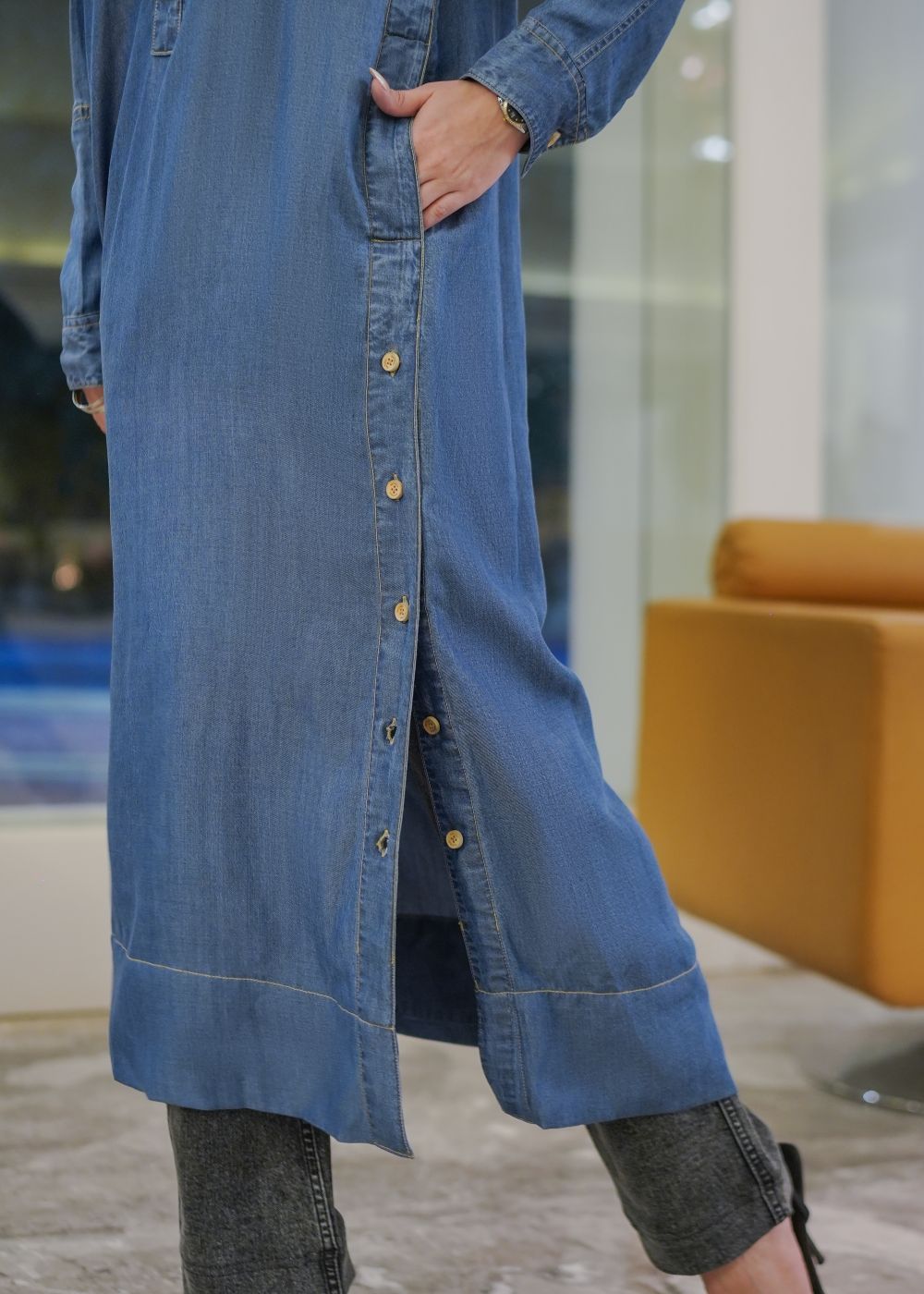 Women's long blue kurta with an open button design