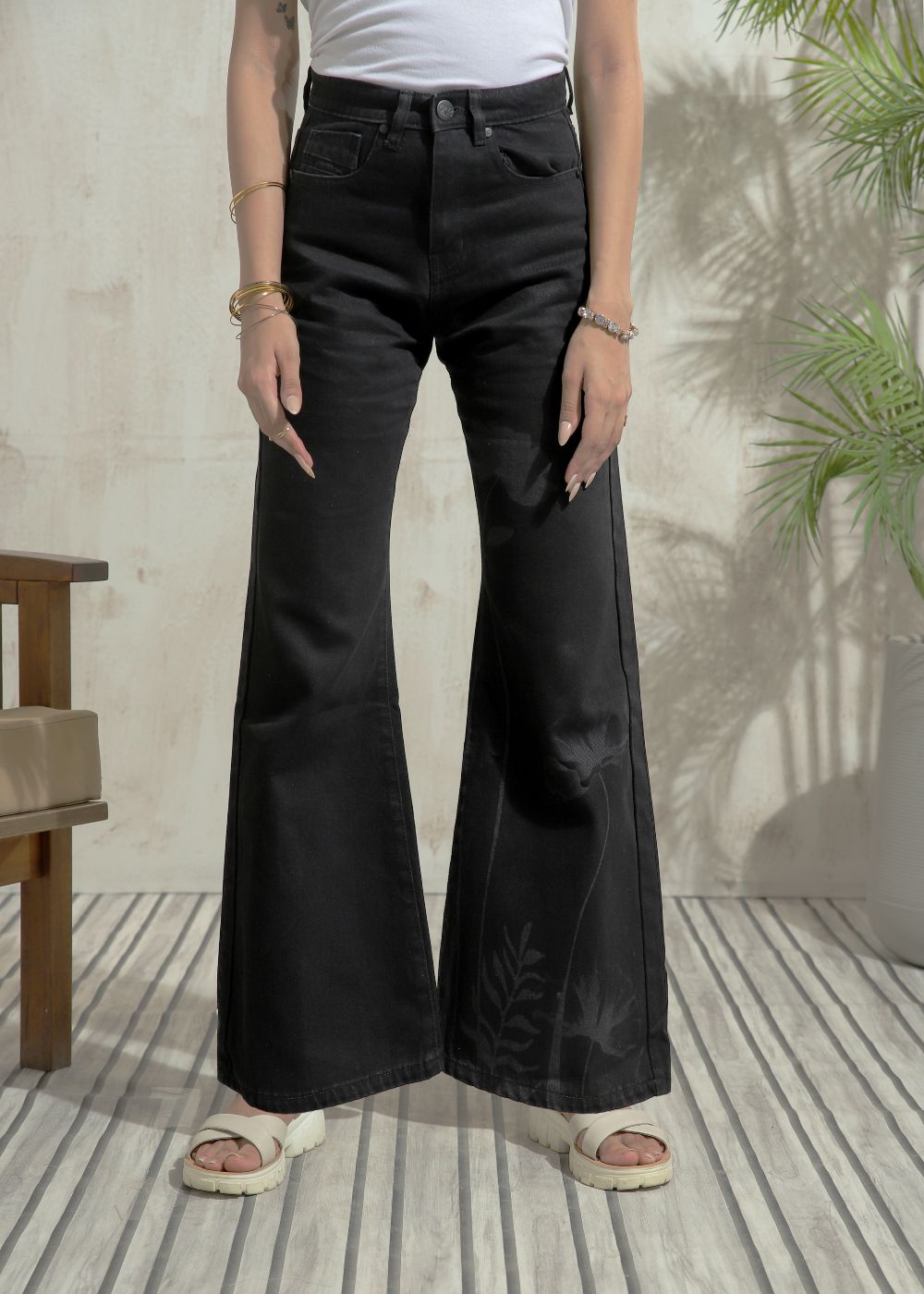 Women's Flare Jeans in Graphic Black with laser-printed designs