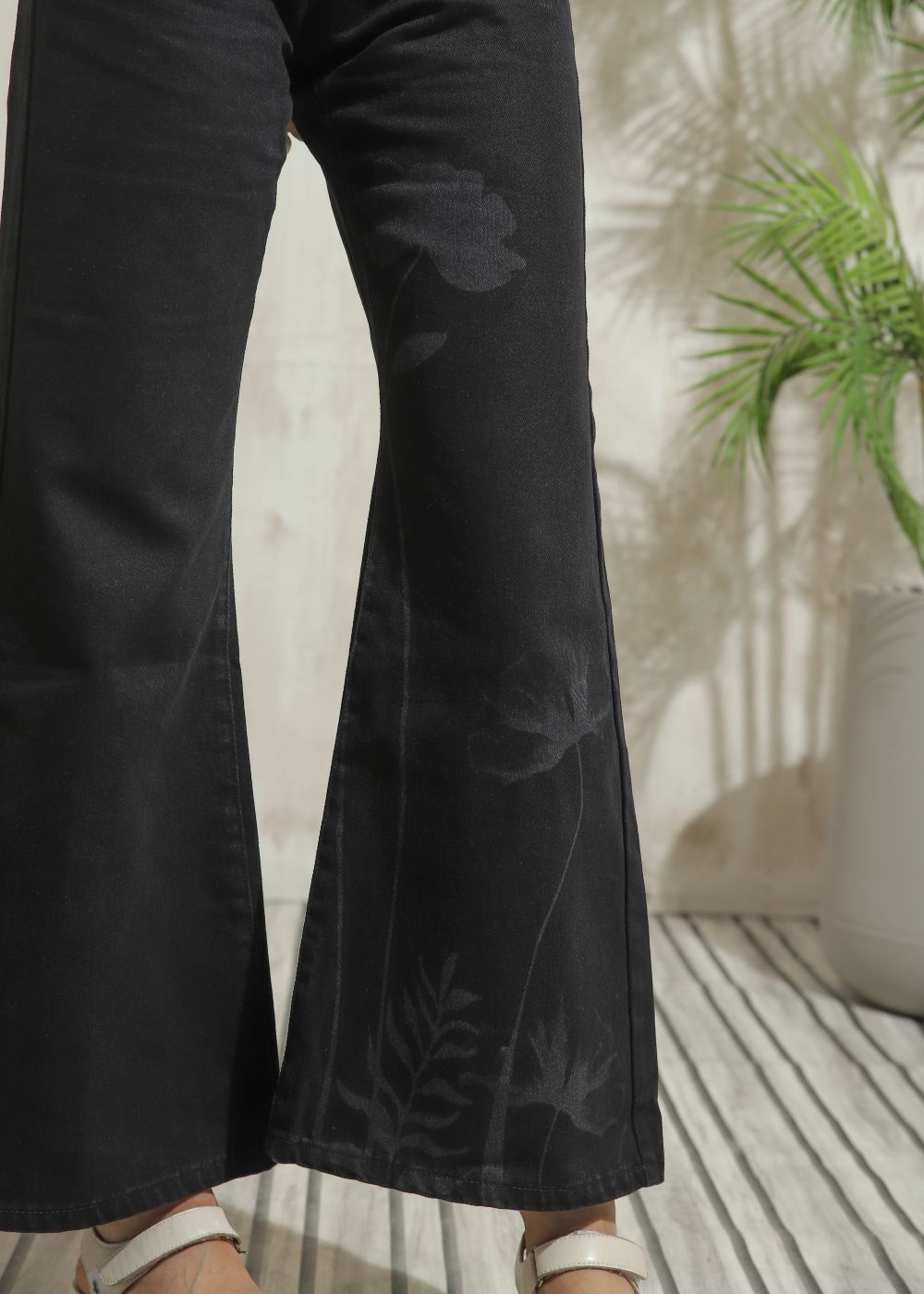 Women's Flare Jeans in Graphic Black with laser-printed designs