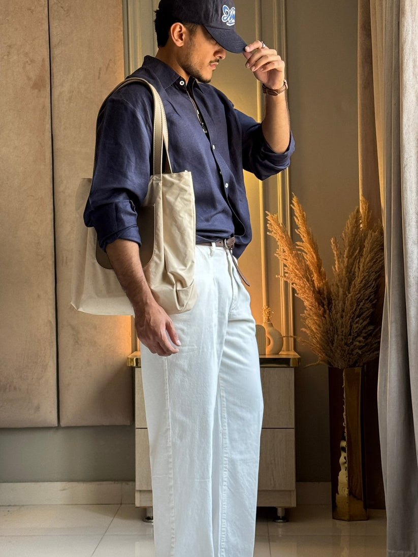 Ivory pleated relaxed jeans men loose fit tailored look smart casual outfit indoor styling