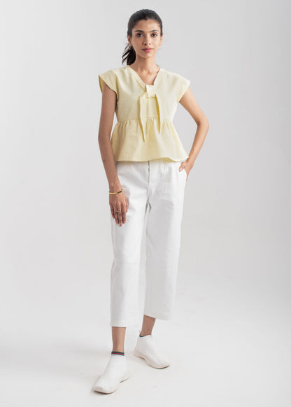 Ladies Peplum Top in Pastel Yellow Featuring a Charming Bow Tie in the Front