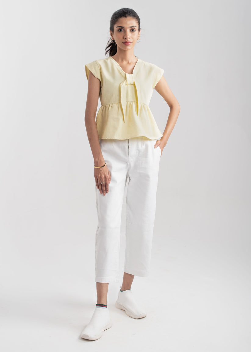 Ladies Peplum Top in Pastel Yellow Featuring a Charming Bow Tie in the Front