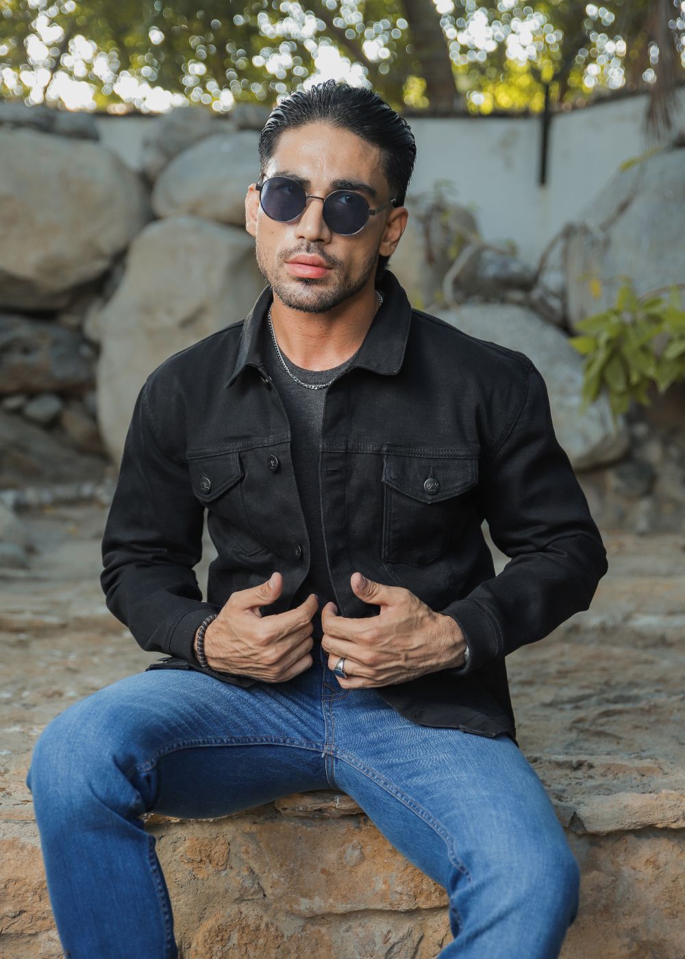 Men's black denim jacket with button-down front