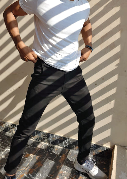 Men’s black skinny fit jeans with stretch fabric and tapered ankle design
