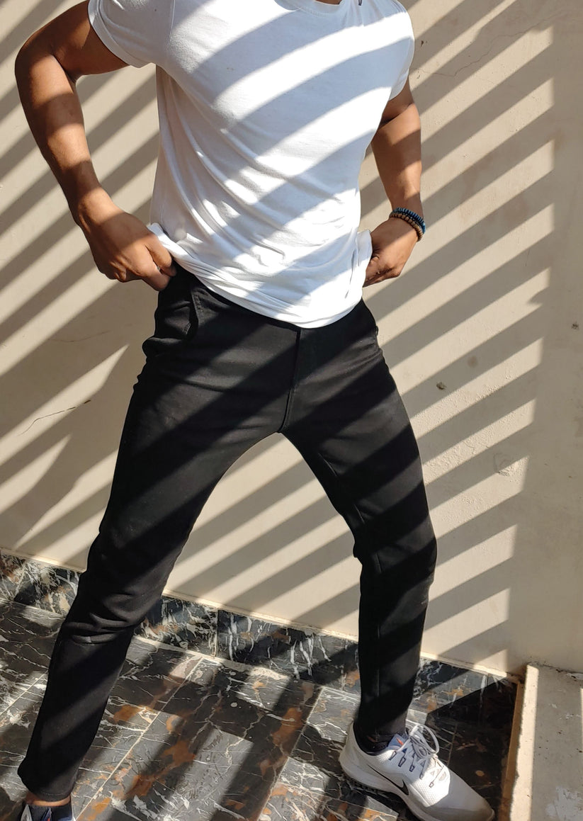 Men’s black skinny fit jeans with stretch fabric and tapered ankle design