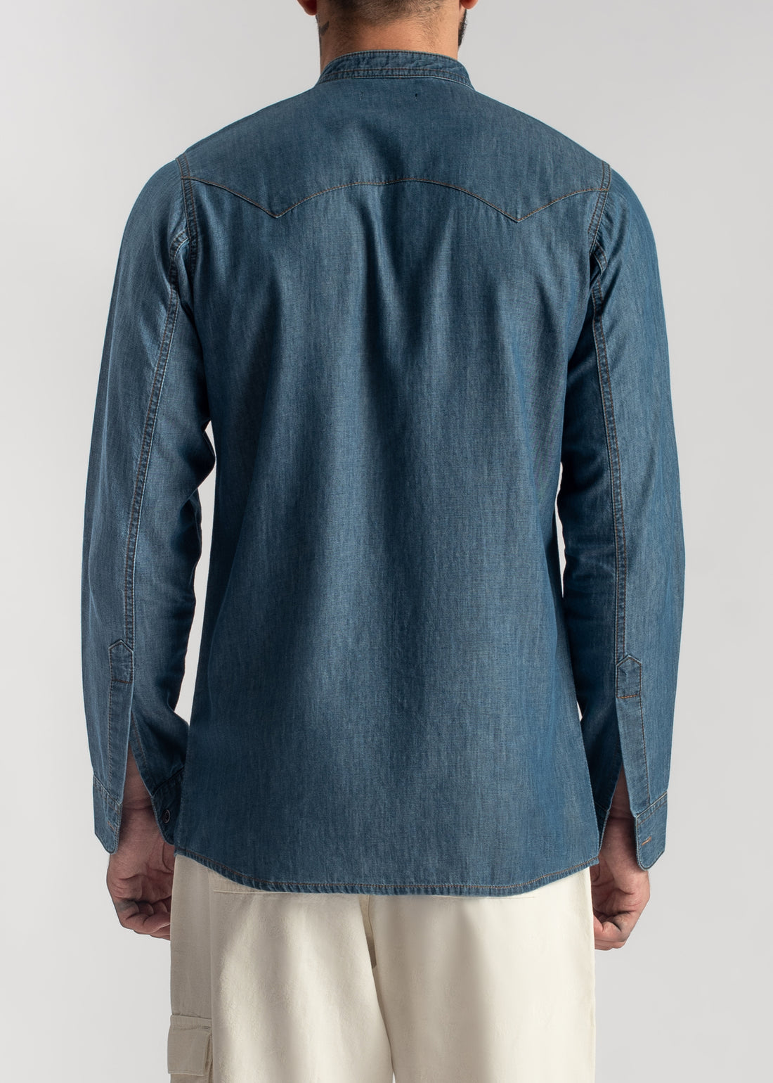 Men's blue denim band collar shirt with relaxed fit and casual styling