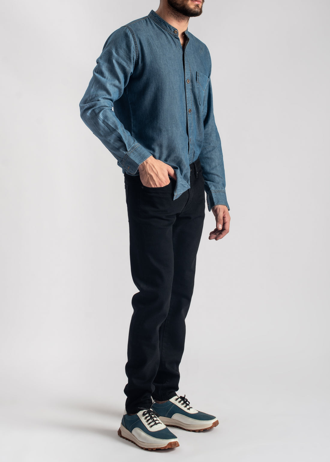 Men's blue denim band collar shirt with relaxed fit and casual styling