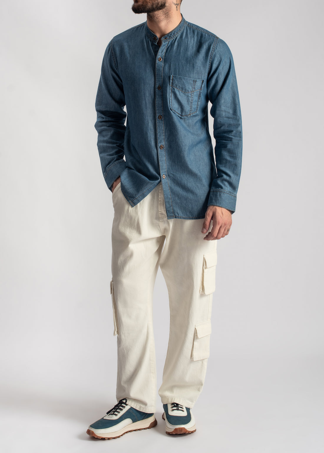 Men's blue denim band collar shirt with relaxed fit and casual styling