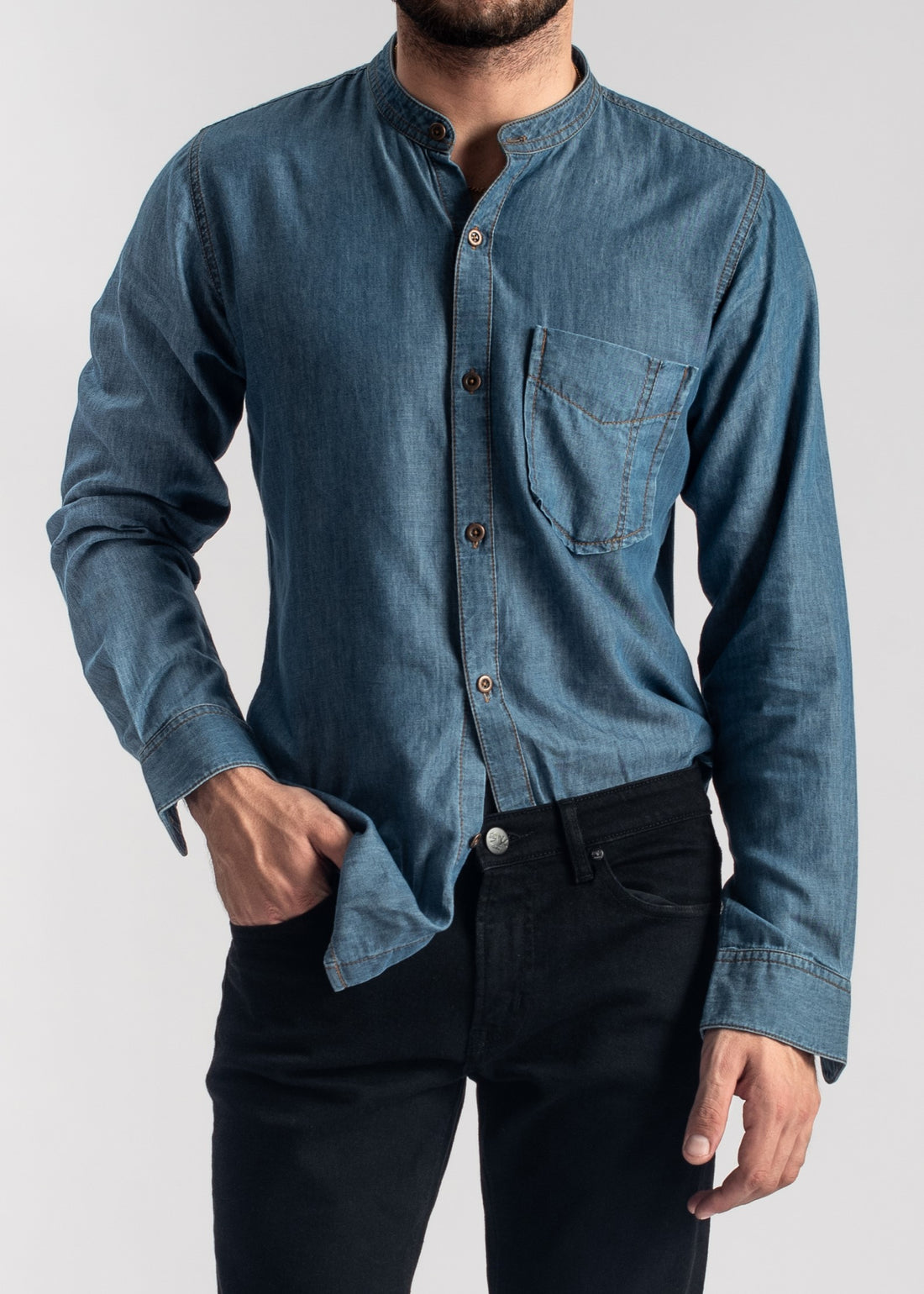 Men's blue denim band collar shirt with relaxed fit and casual styling