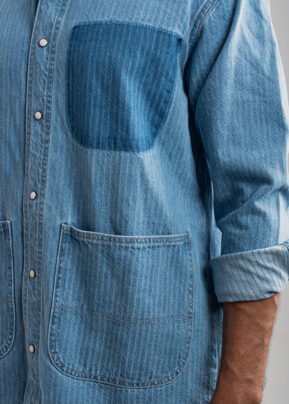 Men's blue striped denim shirt with vertical stripes and relaxed styling