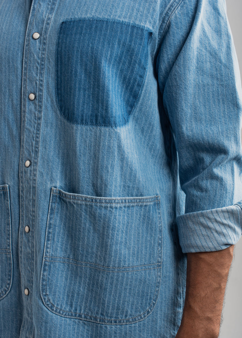 Men's blue striped denim shirt with vertical stripes and relaxed styling